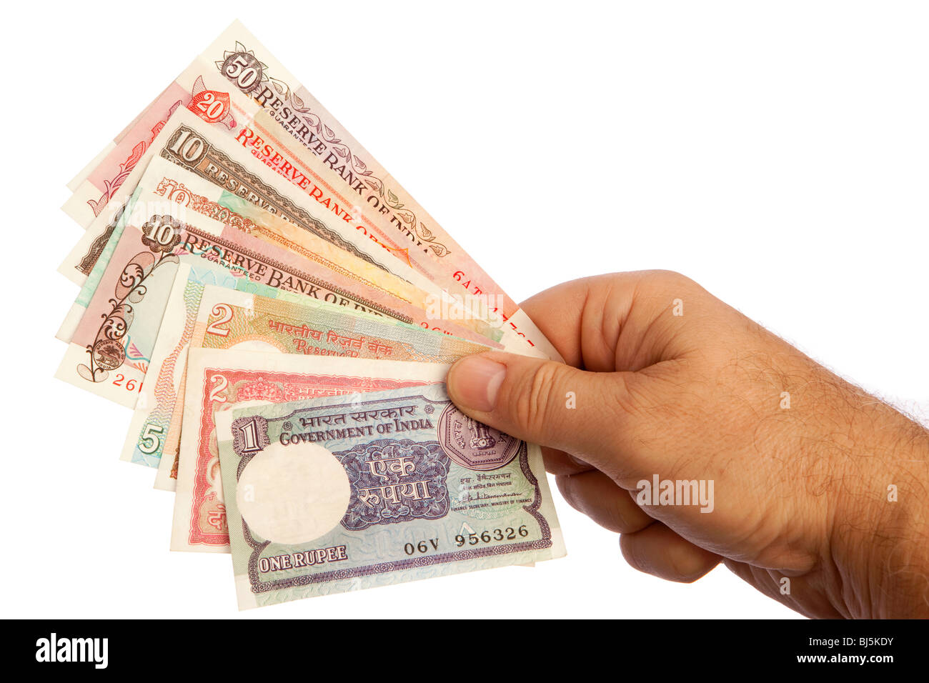 Geld männliche Hand, die Handvoll alte indische Währung Stockfoto