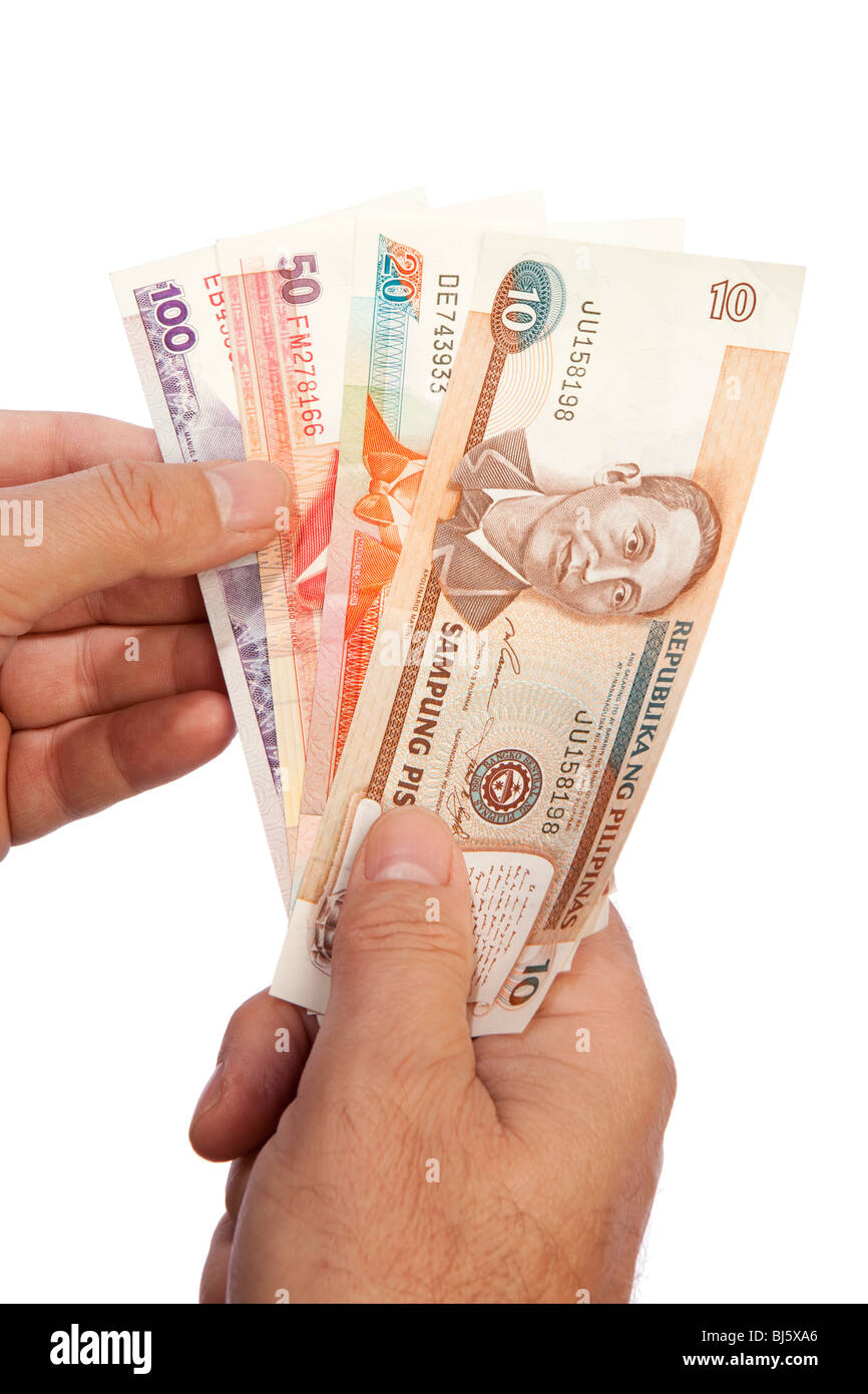 Geld männliche Hand, die Handvoll Philippinen Währung Stockfoto