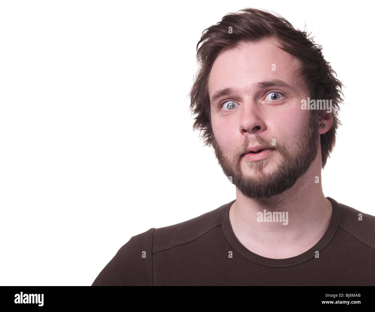 Porträt eines Mannes, überrascht. Auf weiß mit textfreiraum isoliert. Stockfoto