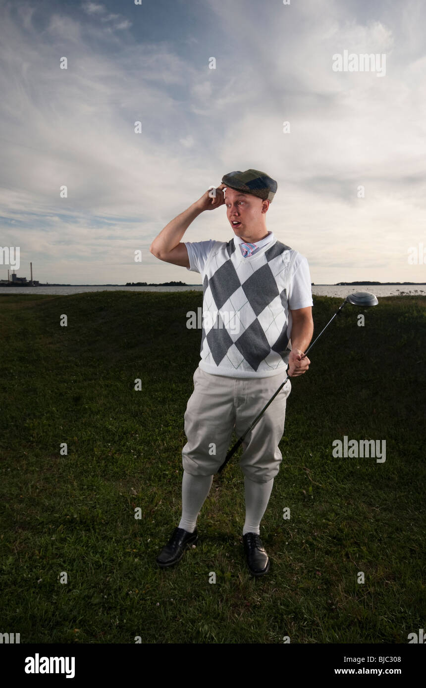 Lustige Foto eines Golfers, die auf der Suche nach seinem vermissten Ball. Stockfoto