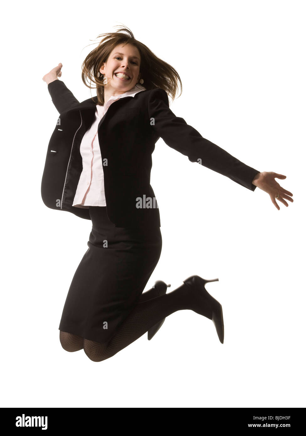 Geschäftsfrau, die in die Luft springen Stockfoto