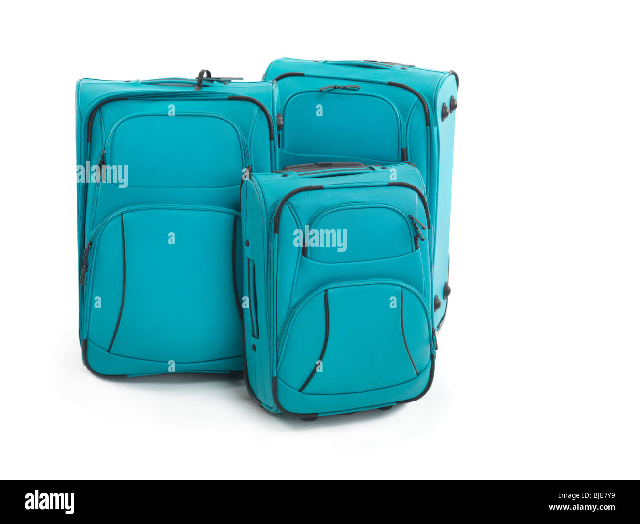 Drei blaue Koffer isoliert auf weißem Hintergrund Stockfoto