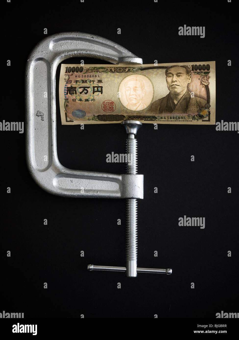 Yen in einer Klemme Stockfoto