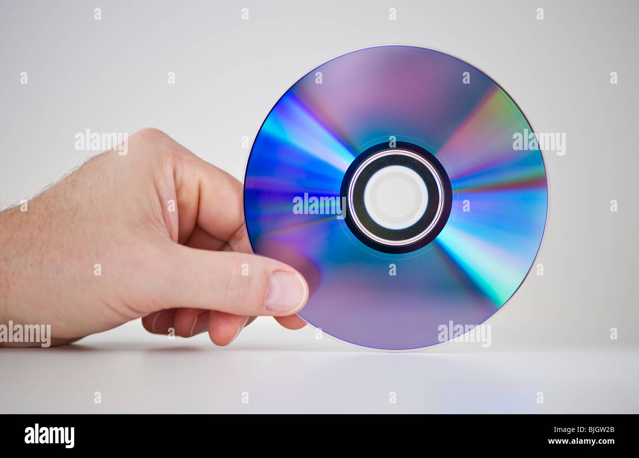 Hand-Holding-CD-ROM Stockfoto