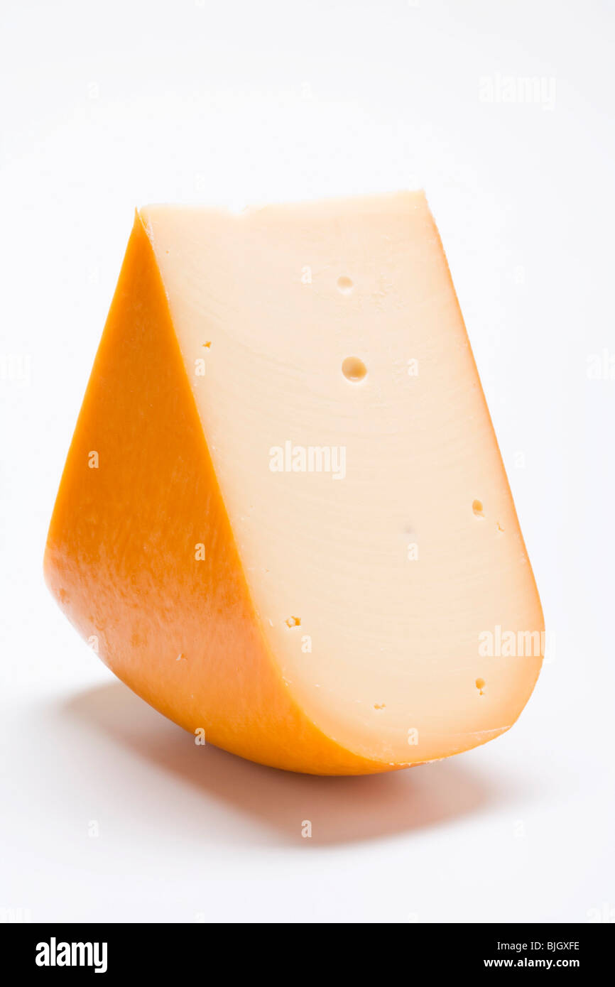 Ein Stück Edamerkäse- Stockfoto