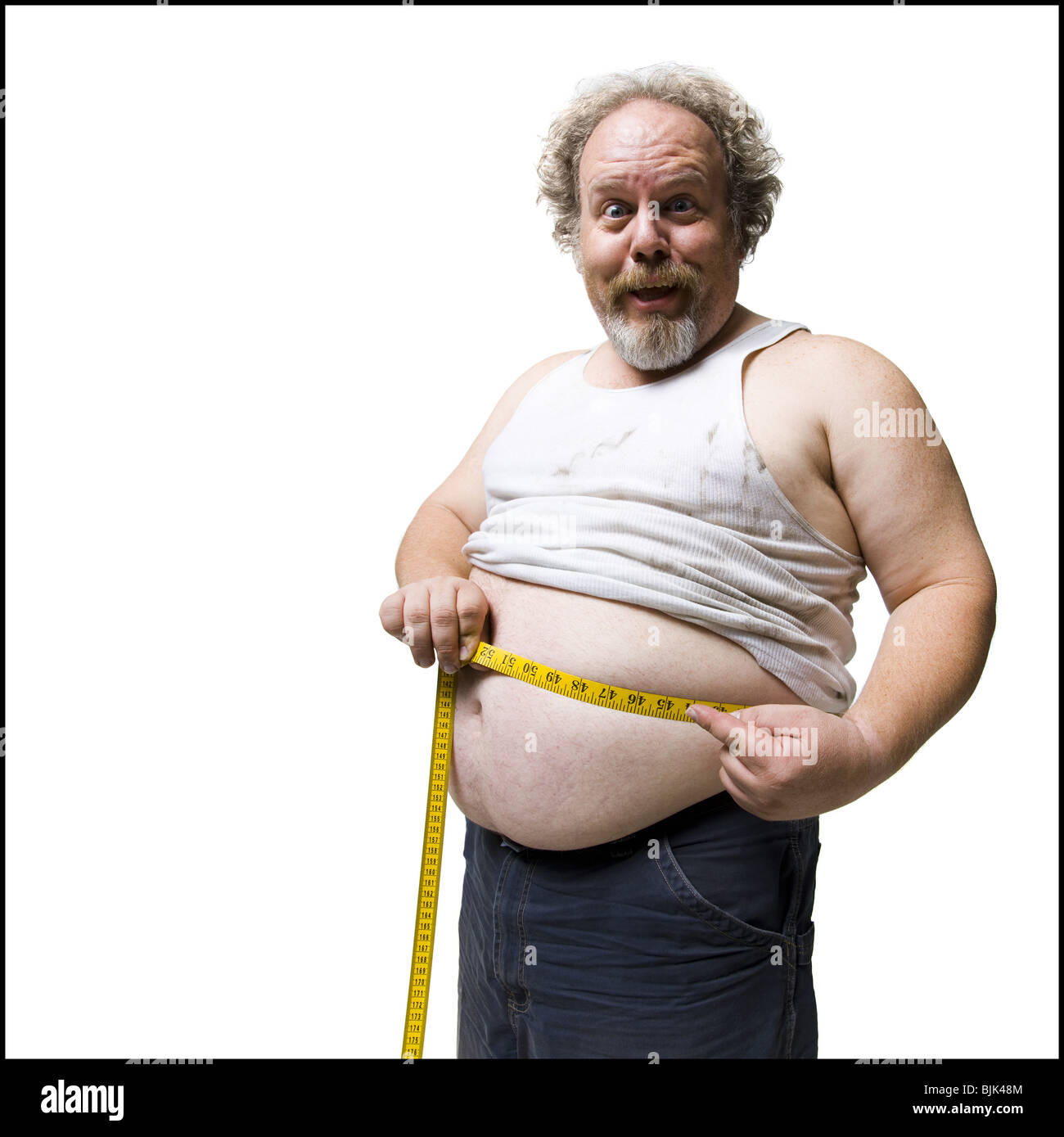 Übergewichtige Menschen messen Taille mit Maßband Stockfoto