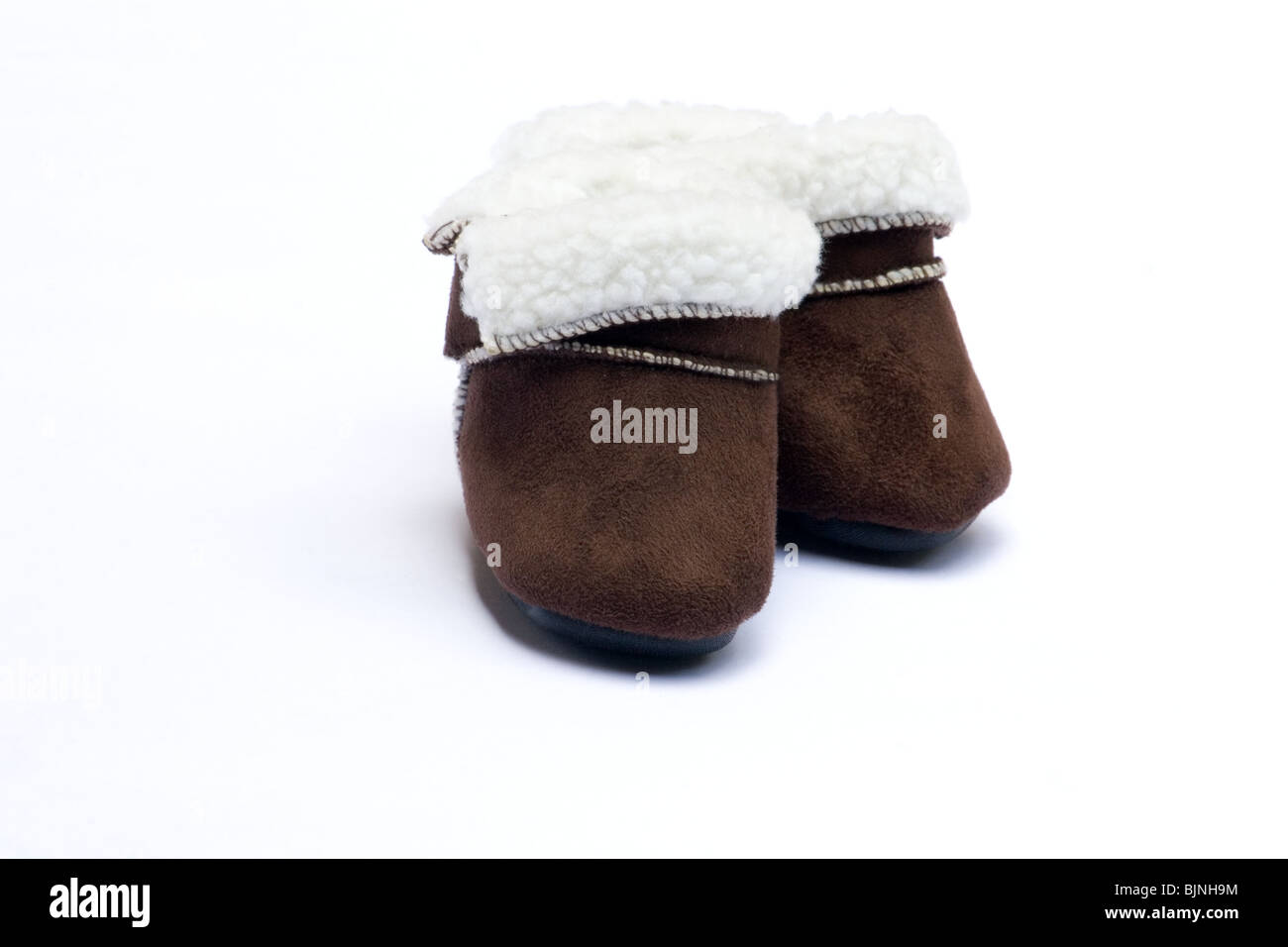 Baby Winter Stiefel auf weißem Hintergrund Stockfoto