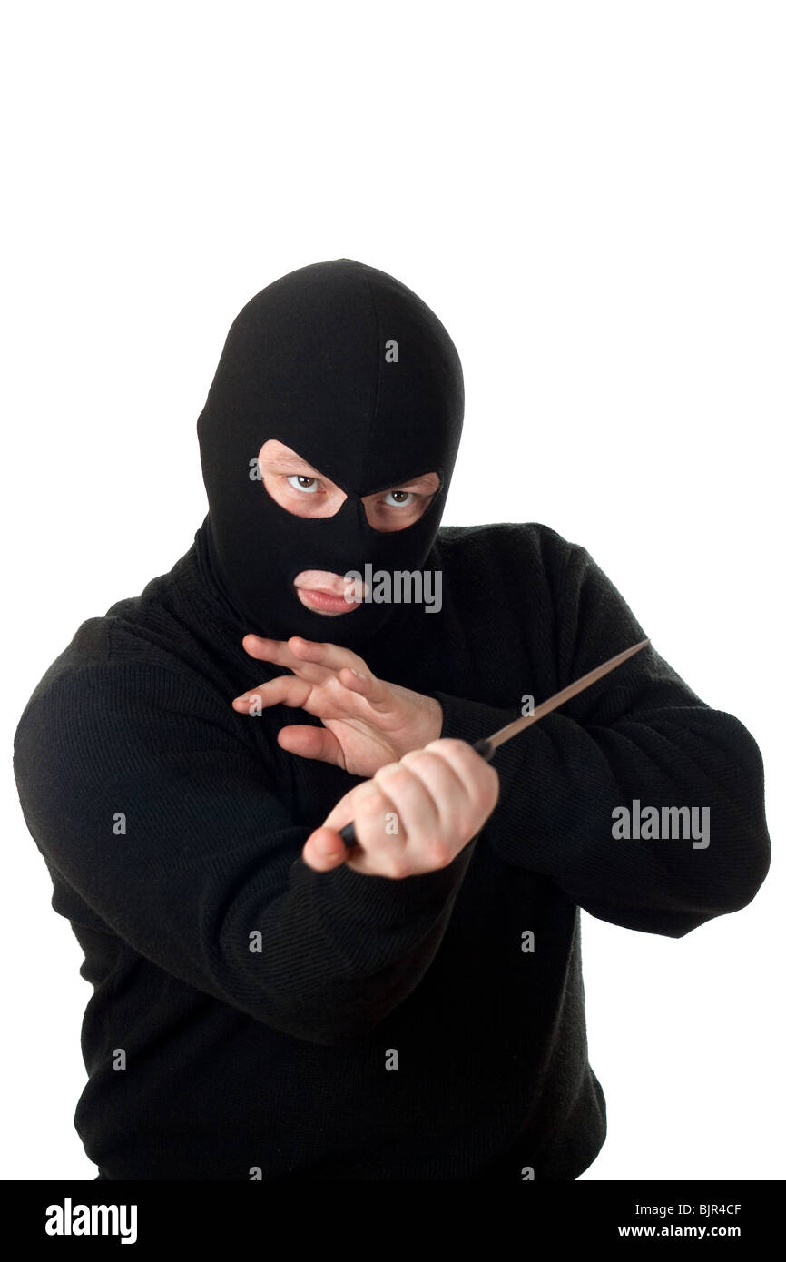 Terroristen in schwarze Maske mit Messer. Isoliert auf weiss. Stockfoto