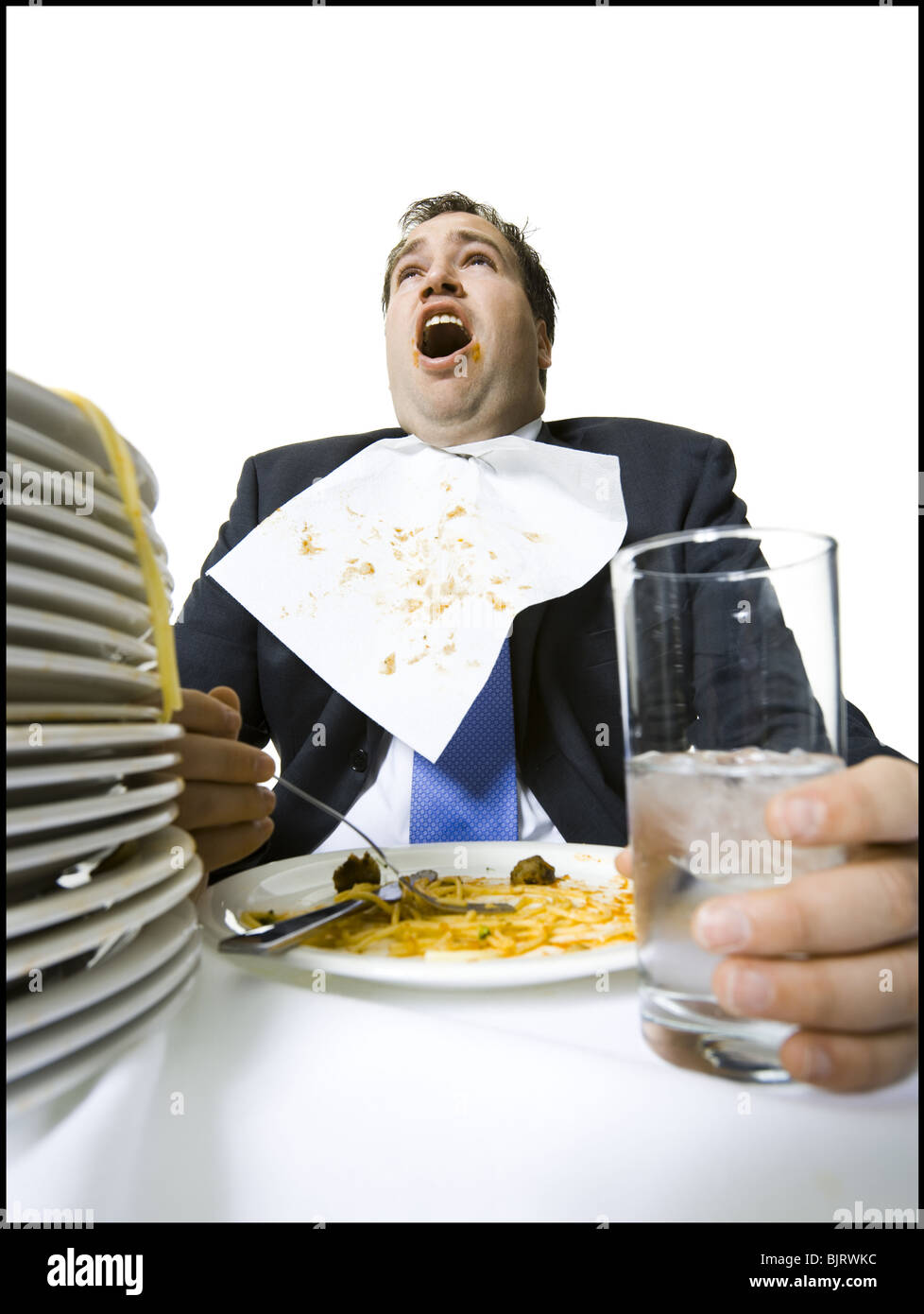 Geschäftsmann, fressen sich auf Spaghetti mit Übergewicht Stockfoto