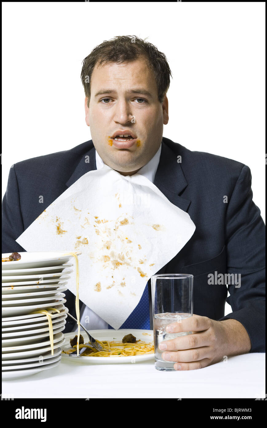 Geschäftsmann, fressen sich auf Spaghetti mit Übergewicht Stockfoto