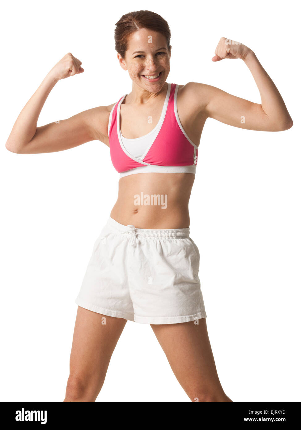 Junge Frau ihre Muskeln, Studio gedreht Stockfoto