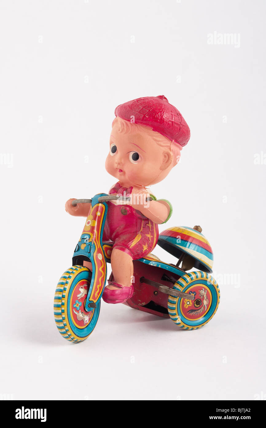 antikes Spielzeug junge auf Metall Windup Dreirad mit Glocke Stockfoto