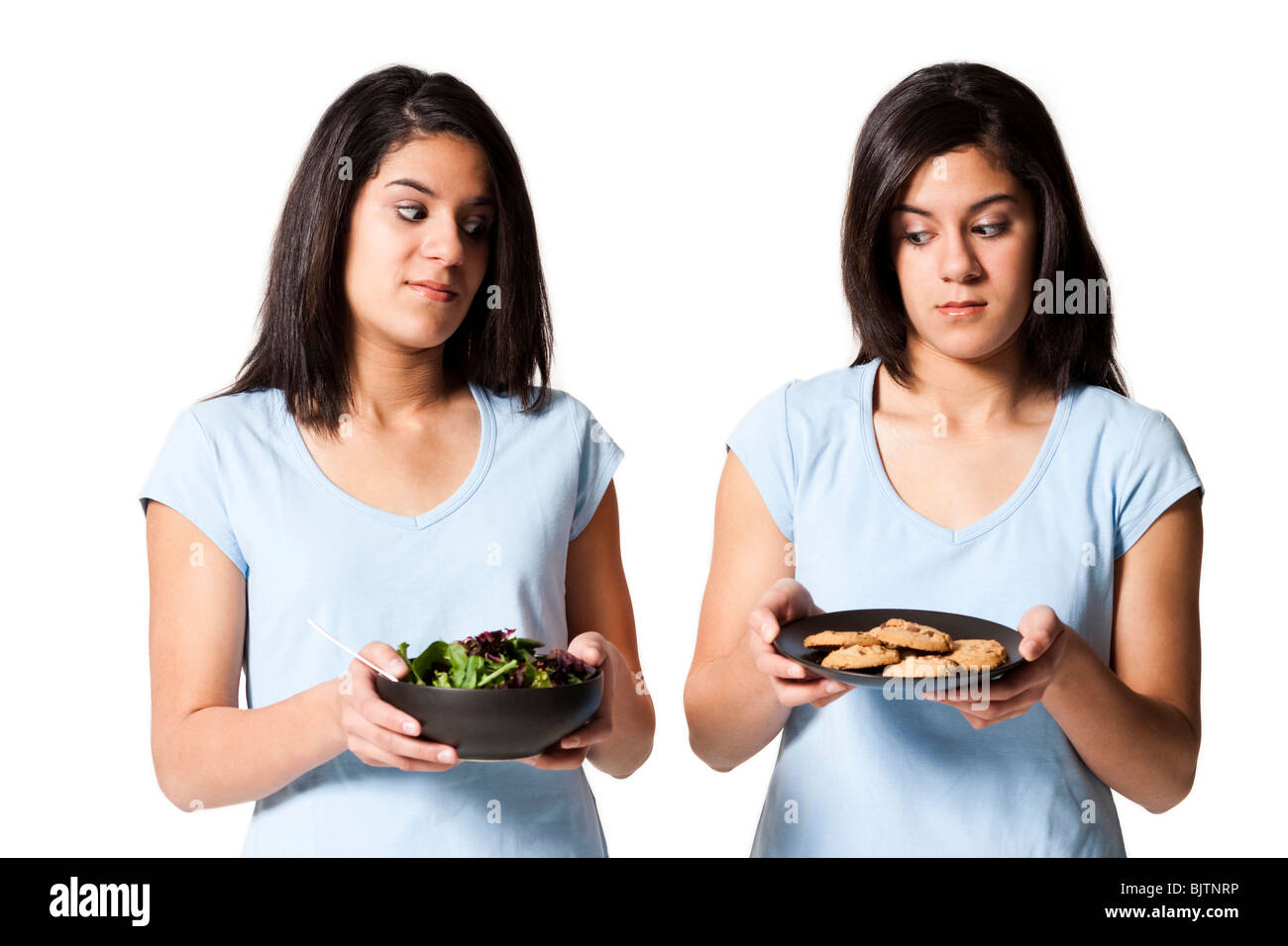 Schwestern mit Salat und cookies Stockfoto