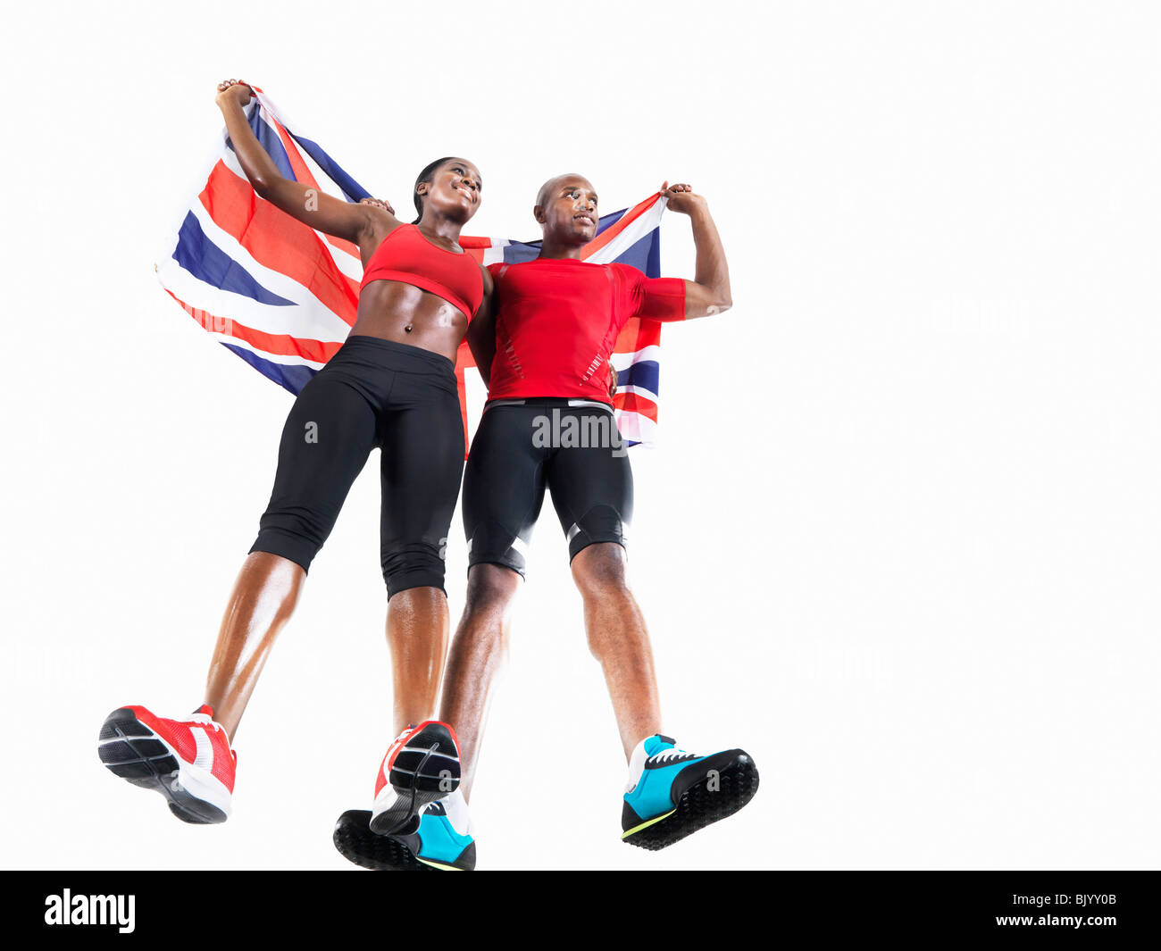 Athleten feiern mit Union Jack Stockfoto