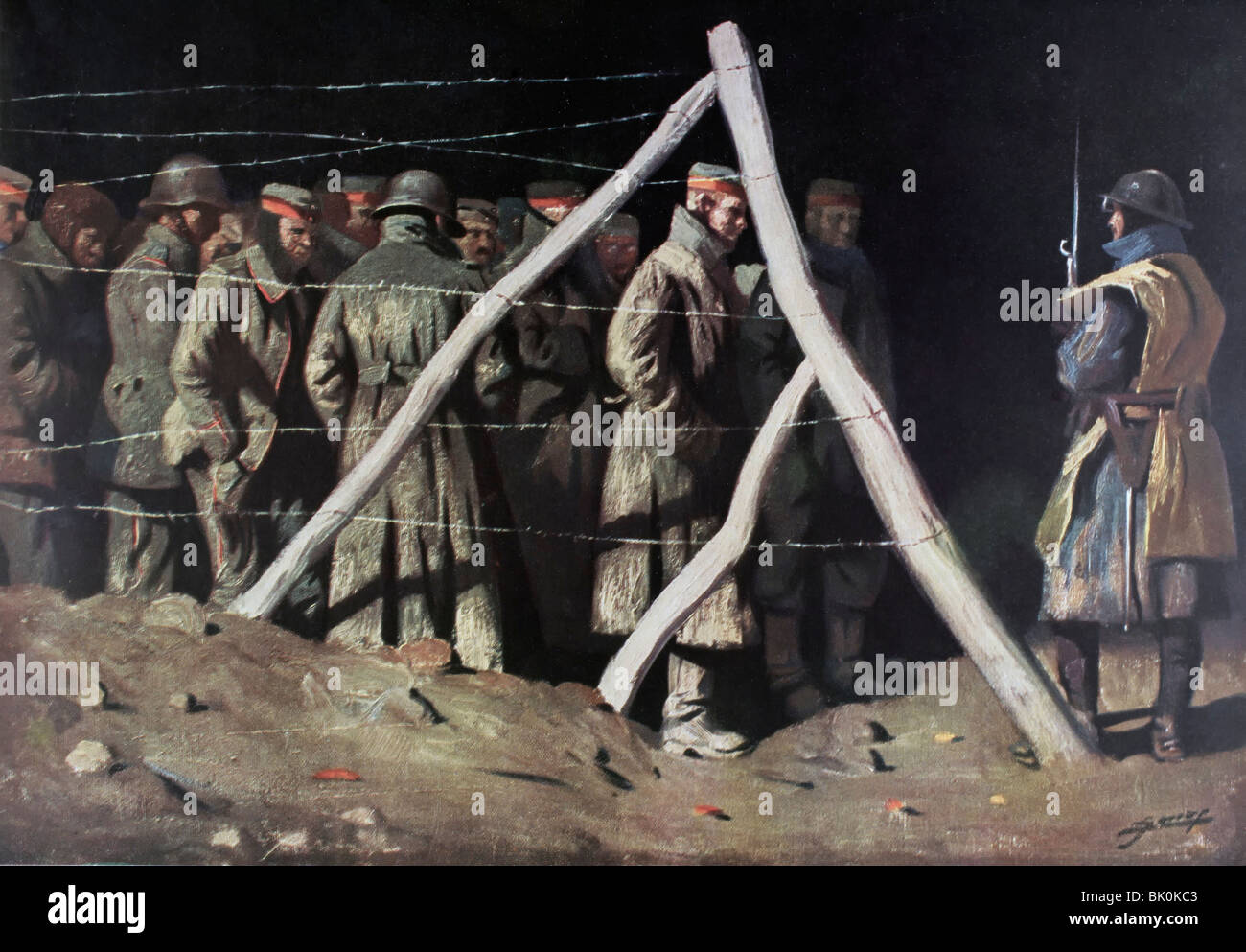 Französischer Soldat mit deutschen Kriegsgefangenen in einem Kriegsgefangenenlager während des ersten Weltkrieges. Stockfoto