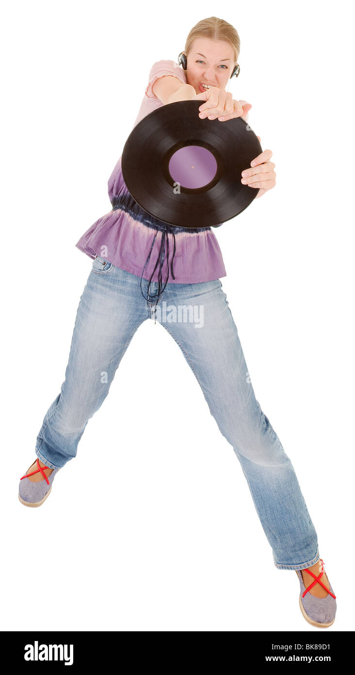 junges Mädchen mit einer Vinyl-Schallplatte und Kopfhörer Stockfoto