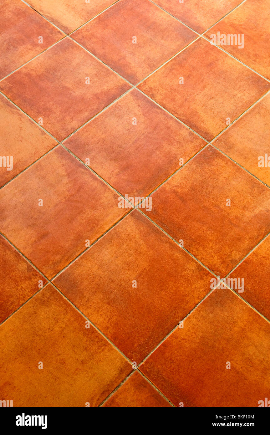 Nahaufnahme des quadratischen Terrakotta Fliesen Boden Hintergrund Stockfoto