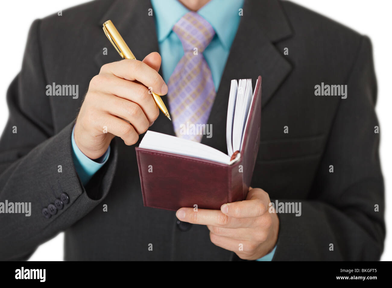 Geschäftsleute aufzeichnen in einem Notizbuch, isoliert auf weiss Informationen Stockfoto