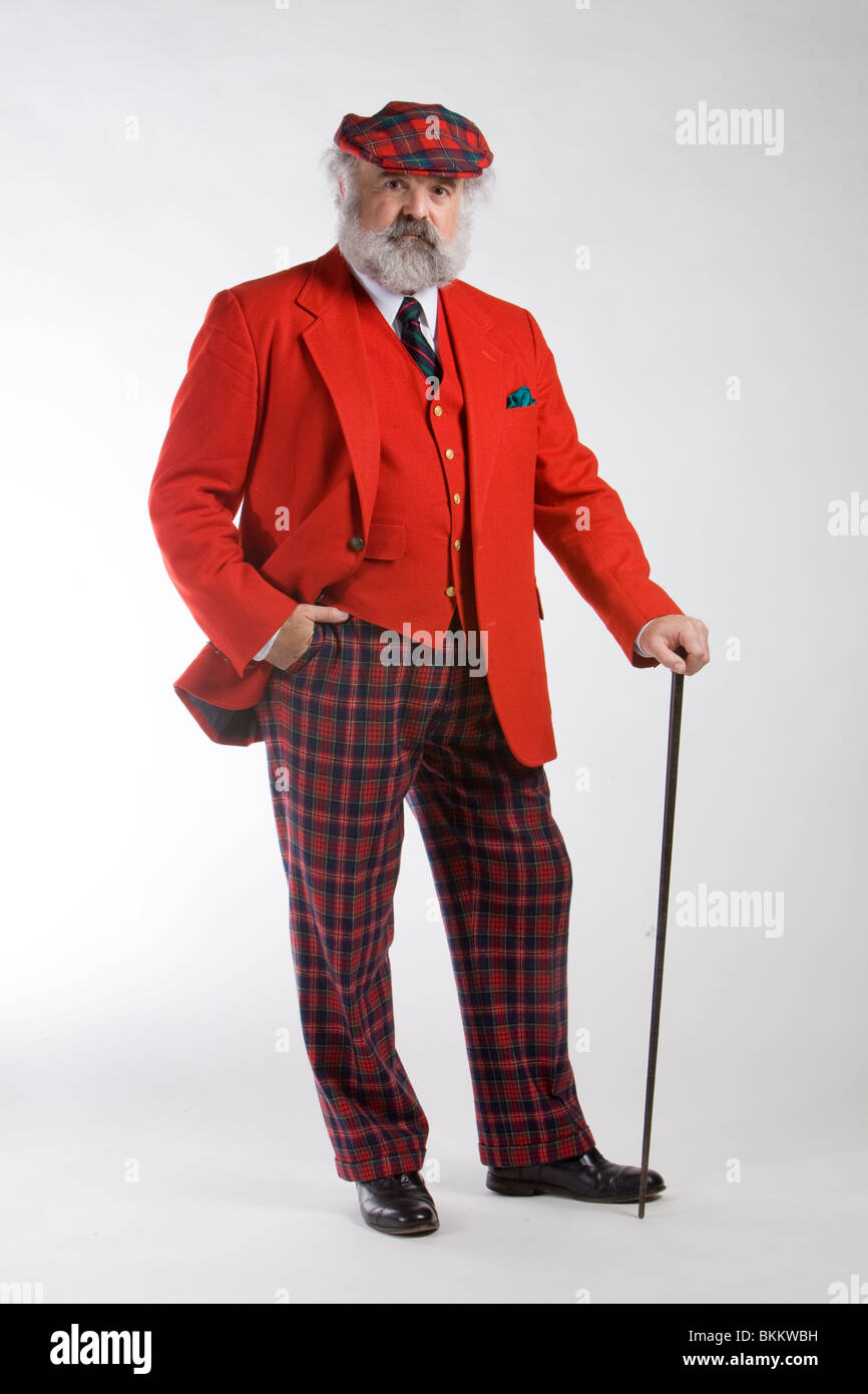 Mann in einem roten Mantel mit einem Gehstock Stockfoto