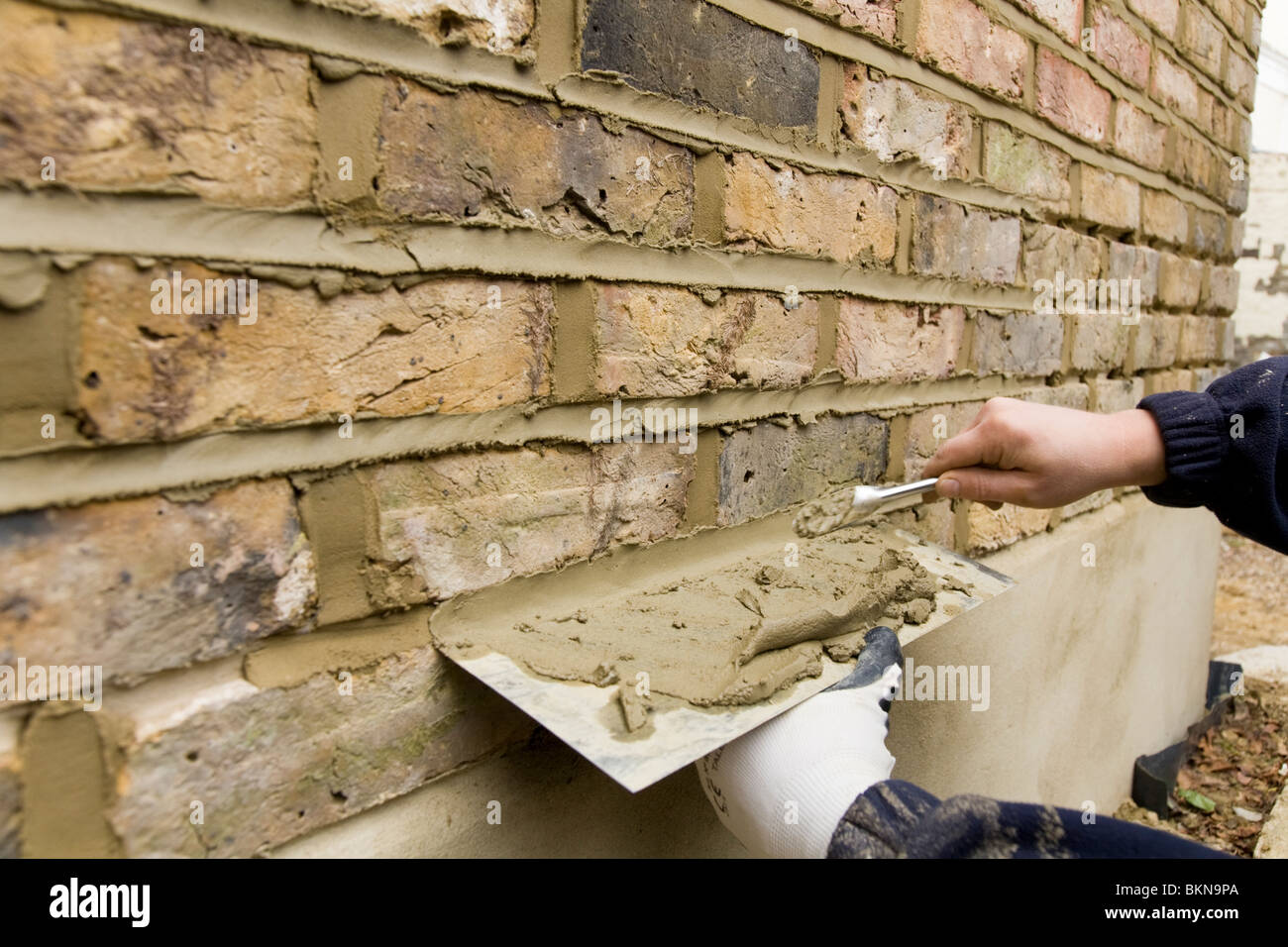 Eine Mauer wird wieder Spitzen / zeigt eine Mauer. Stockfoto