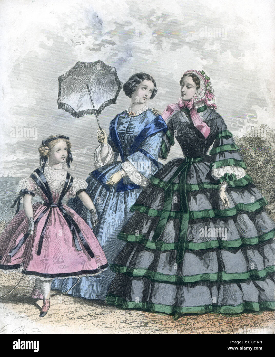 Zwei Frauen in traditionellen viktorianischen Kostümen mit jungen Mädchen Stockfoto