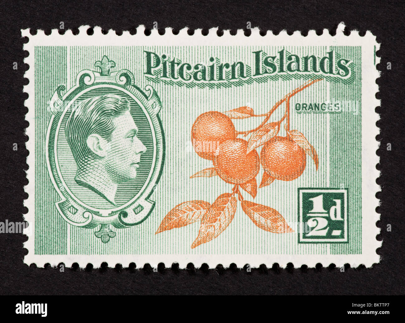 Briefmarke aus der Pitcairn-Inseln mit Orangen und George VI. Stockfoto