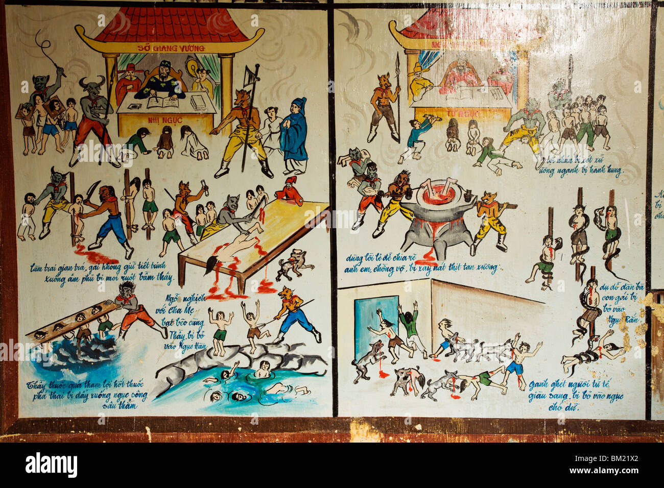 Wandpaneele, die zeigt, was passiert, wenn Sie in der Hölle in Giac Lam Pagode landen Stockfoto