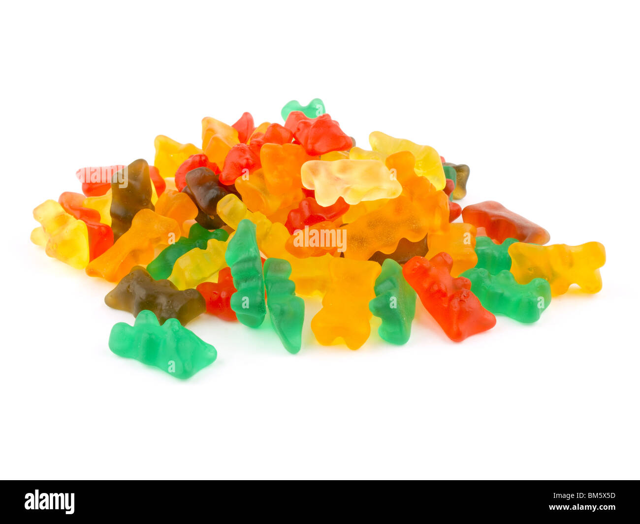 Es gibt viele Gummibärchen auf weißem Hintergrund. Stockfoto