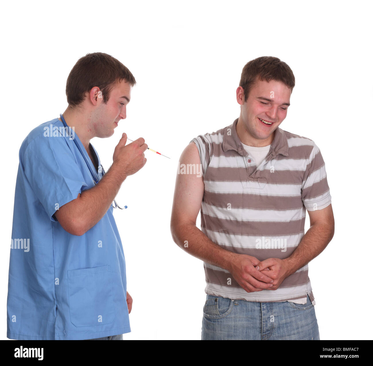 Mai 2010 - junges männliches Modell in medizinischen Schruben als männliche Krankenschwester, Stockfoto