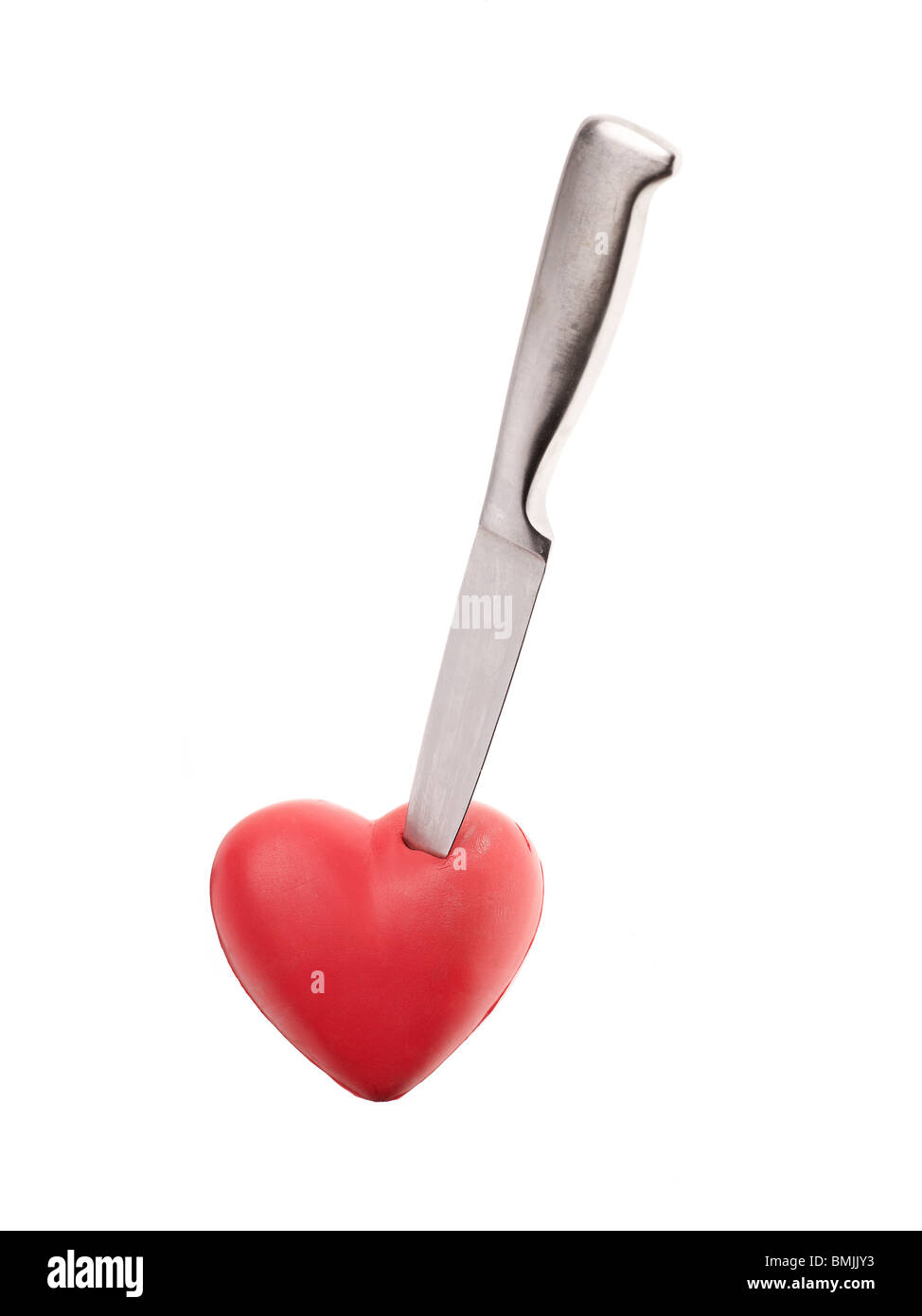 Messer in ein rotes Herz. Stockfoto