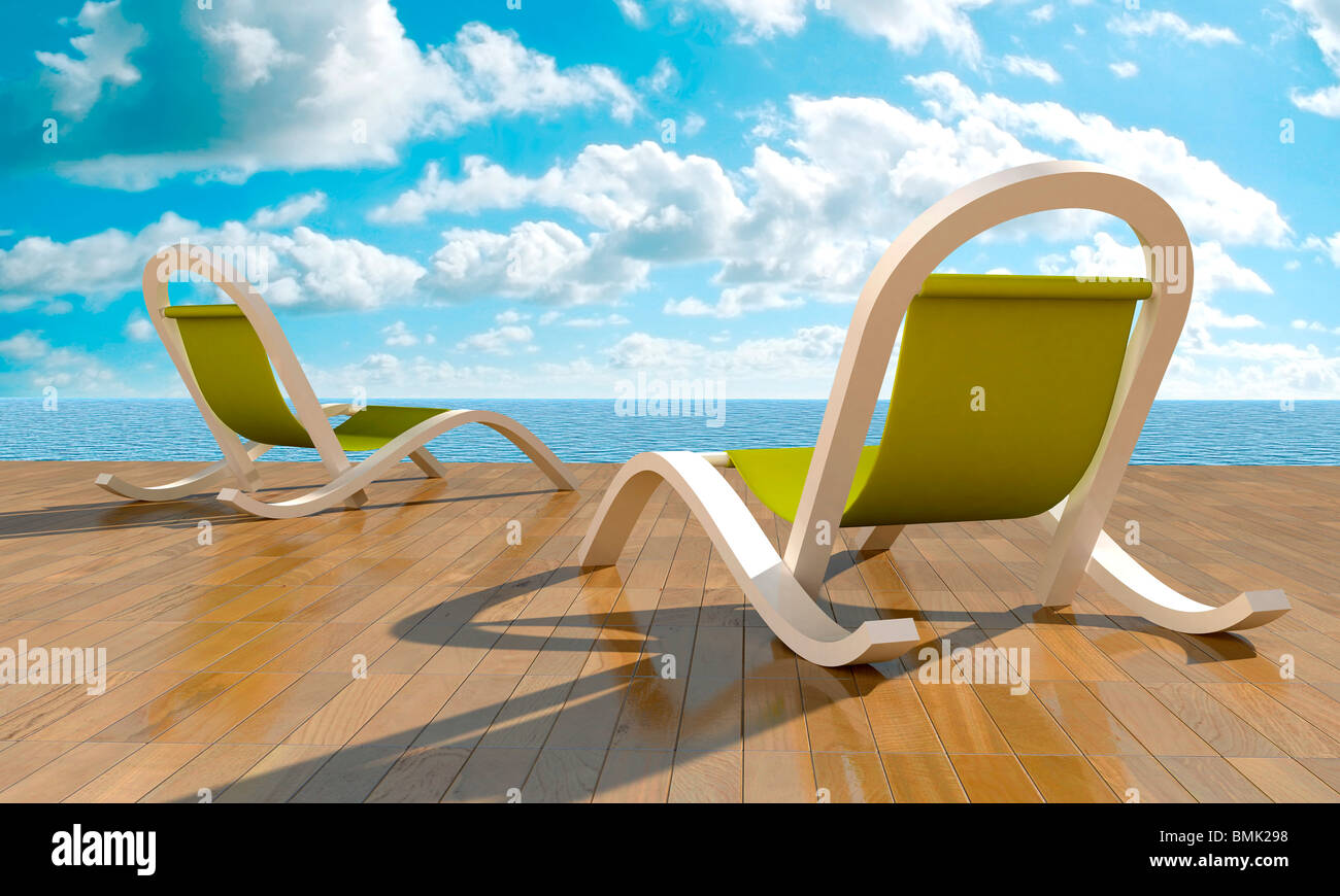 Liegestühlen direkt Meer im Sommertag Stockfoto