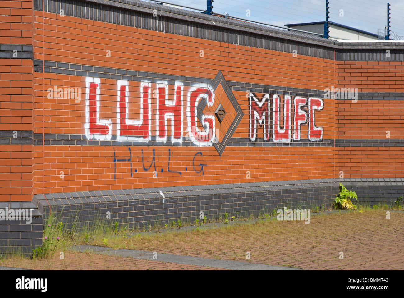 Graffiti an der Wand in der Nähe von Old Trafford Football ground, Manchester, England UK Stockfoto