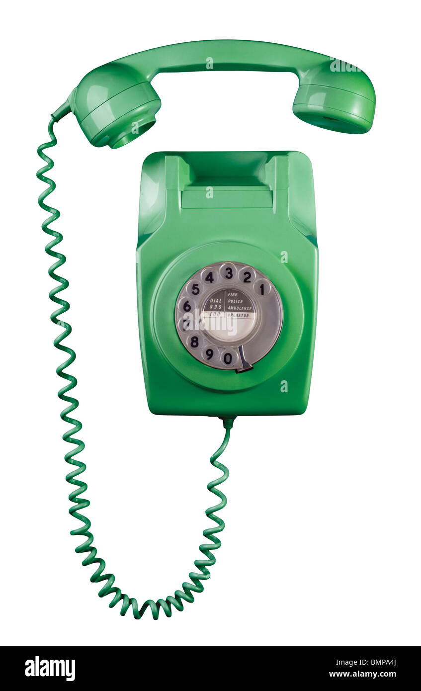 1970er Jahren an der Wand befestigte Telefon mit Mobilteil erhoben, grün gefärbt. Stockfoto