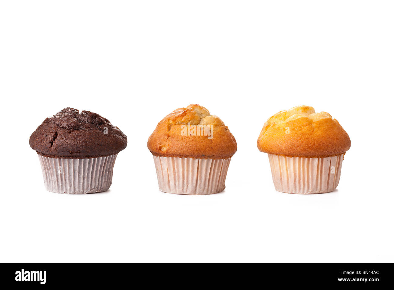 süße Muffins auf weißem Hintergrund Stockfoto