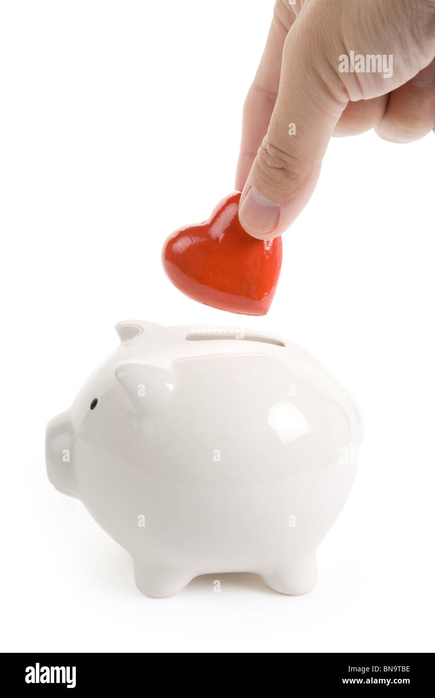 Sparschwein und Red Heart, Konzept der Liebe, Wohltätigkeit Stockfoto
