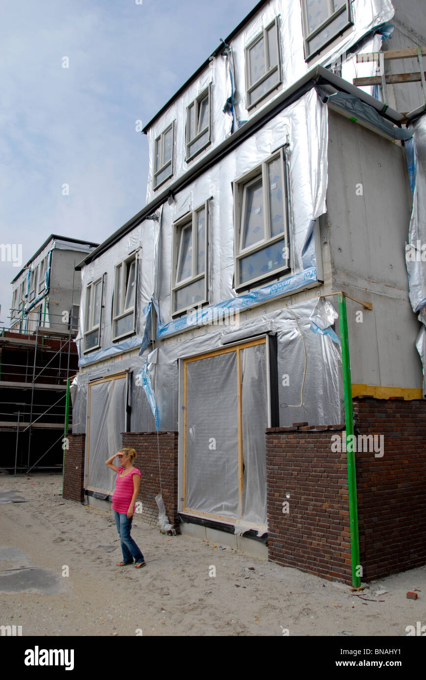 IJburg Amsterdam Haus Bau unvollendet Frau Gebäude Haus Sand Niederlande neu bauen Stockfoto