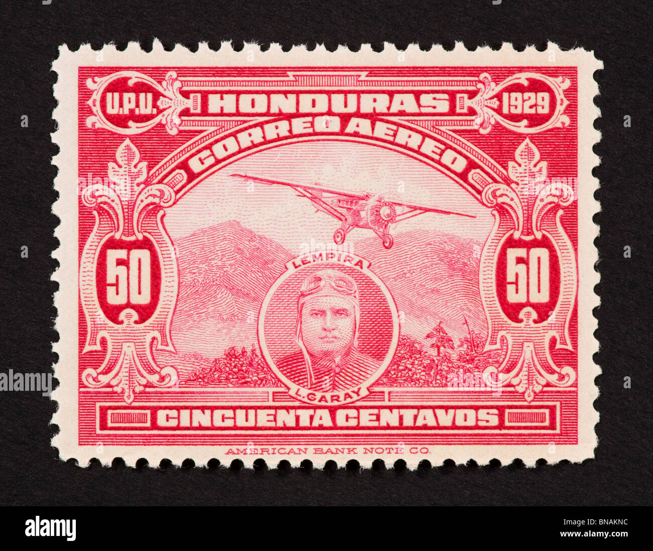 Briefmarke aus Honduras mit einem Eindecker und Lisandro Garay. Stockfoto