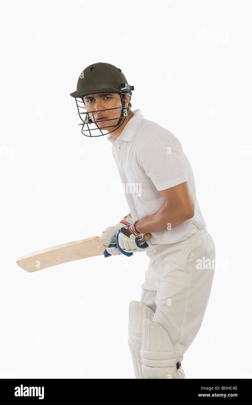 Cricket-Schlagmann mit hohen hinteren Aufzug Stockfoto