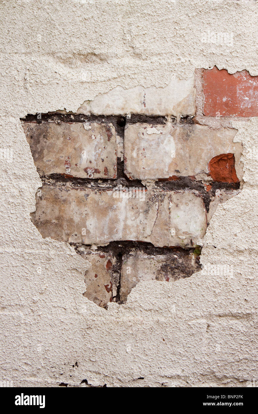 Hauswartungen, Farbe abblättert schlecht gepflegte Mauerwerk benötigen zeigen Stockfoto
