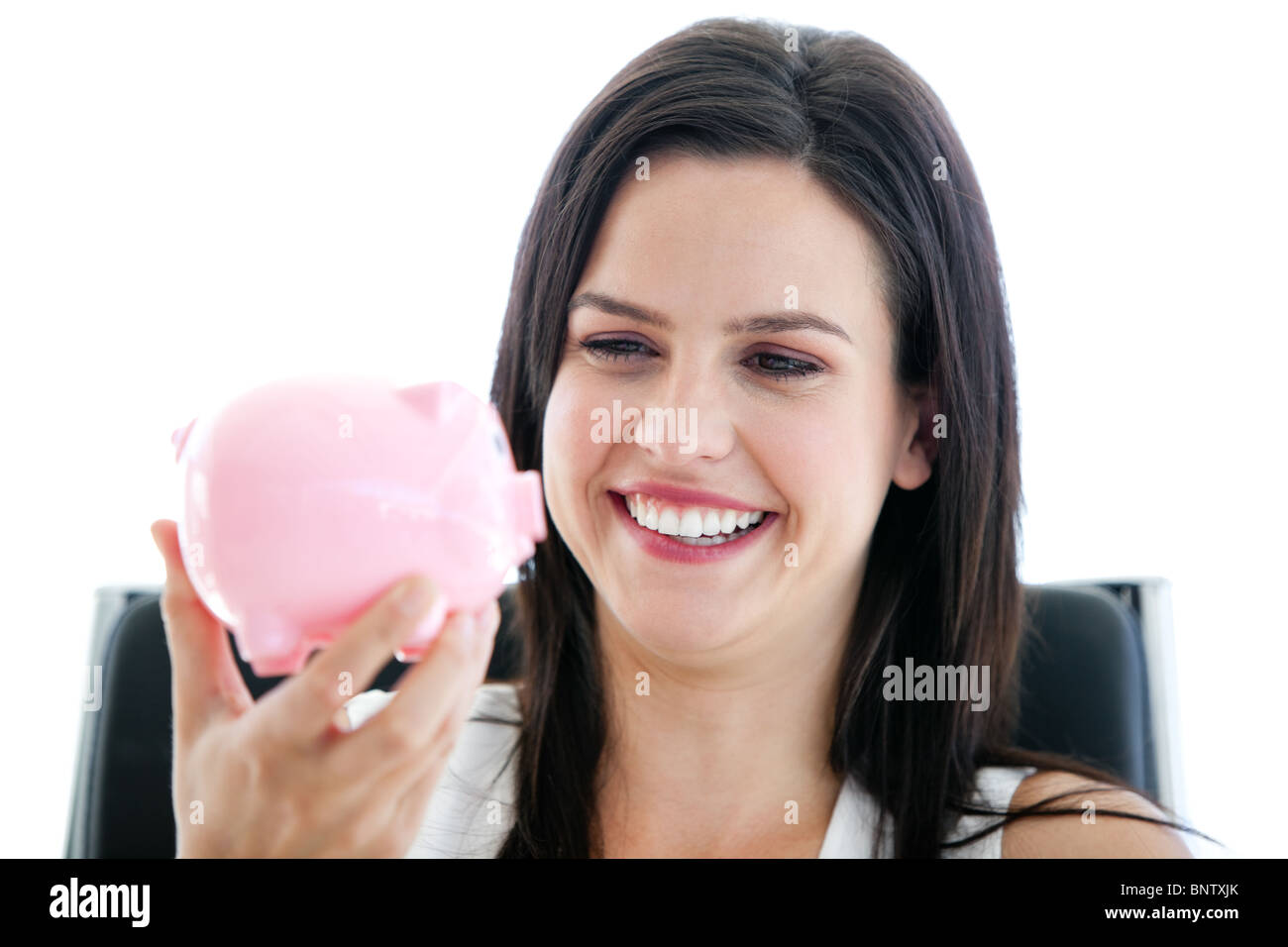 Geschäftsfrau hält ein Sparschwein lachen Stockfotografie - Alamy