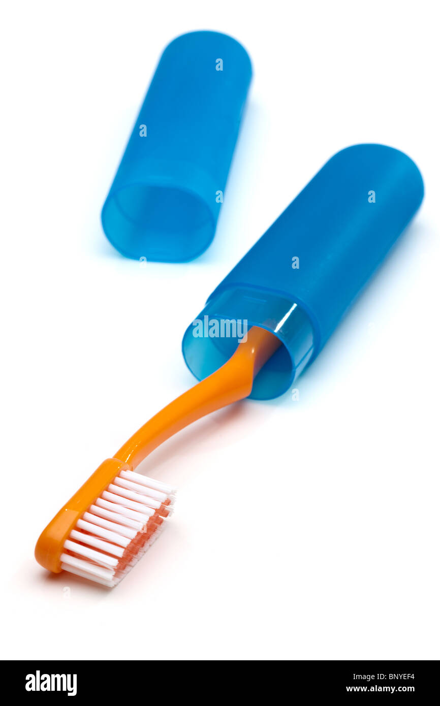 Orange Zahnbürste in einem blauen Etui Stockfoto