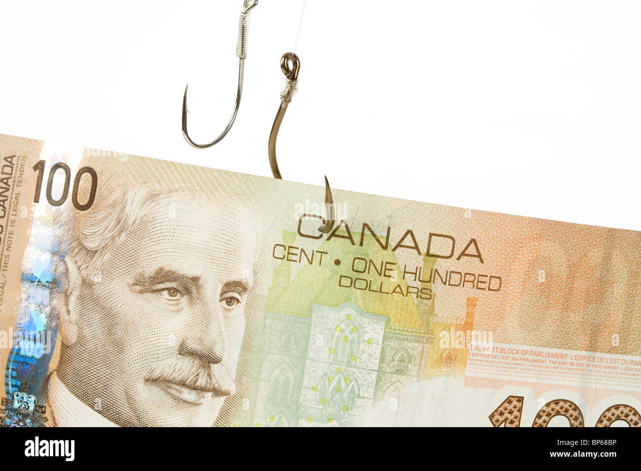Angeln, Haken und kanadische Dollar Nahaufnahme Schuss Stockfoto