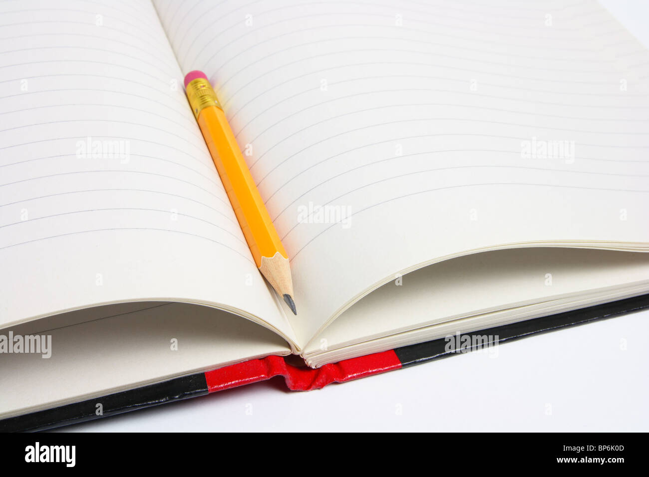 Bleistift und Notizbuch Stockfoto