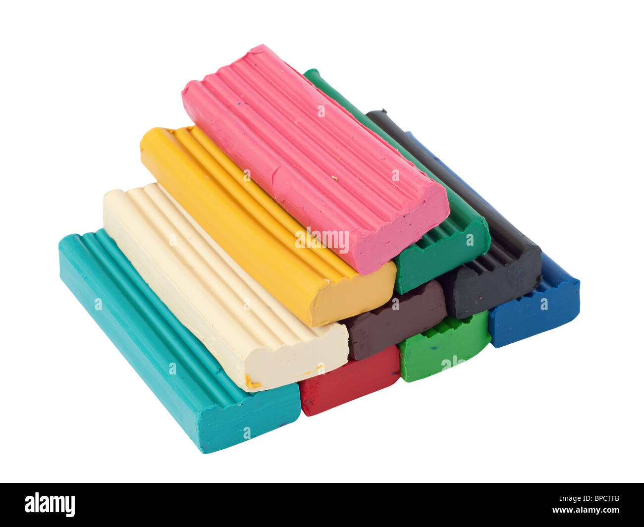 Haufen von farbigem Plastilin Ziegel. Isoliert auf weißem Hintergrund mit Beschneidungspfad. Stockfoto