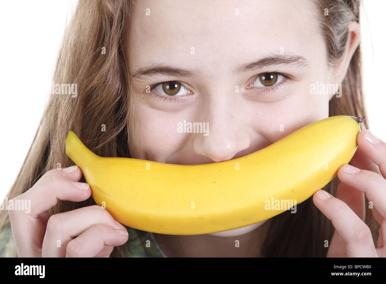 Teengirl mit einer Banane wie einen Schnurrbart Stockfoto