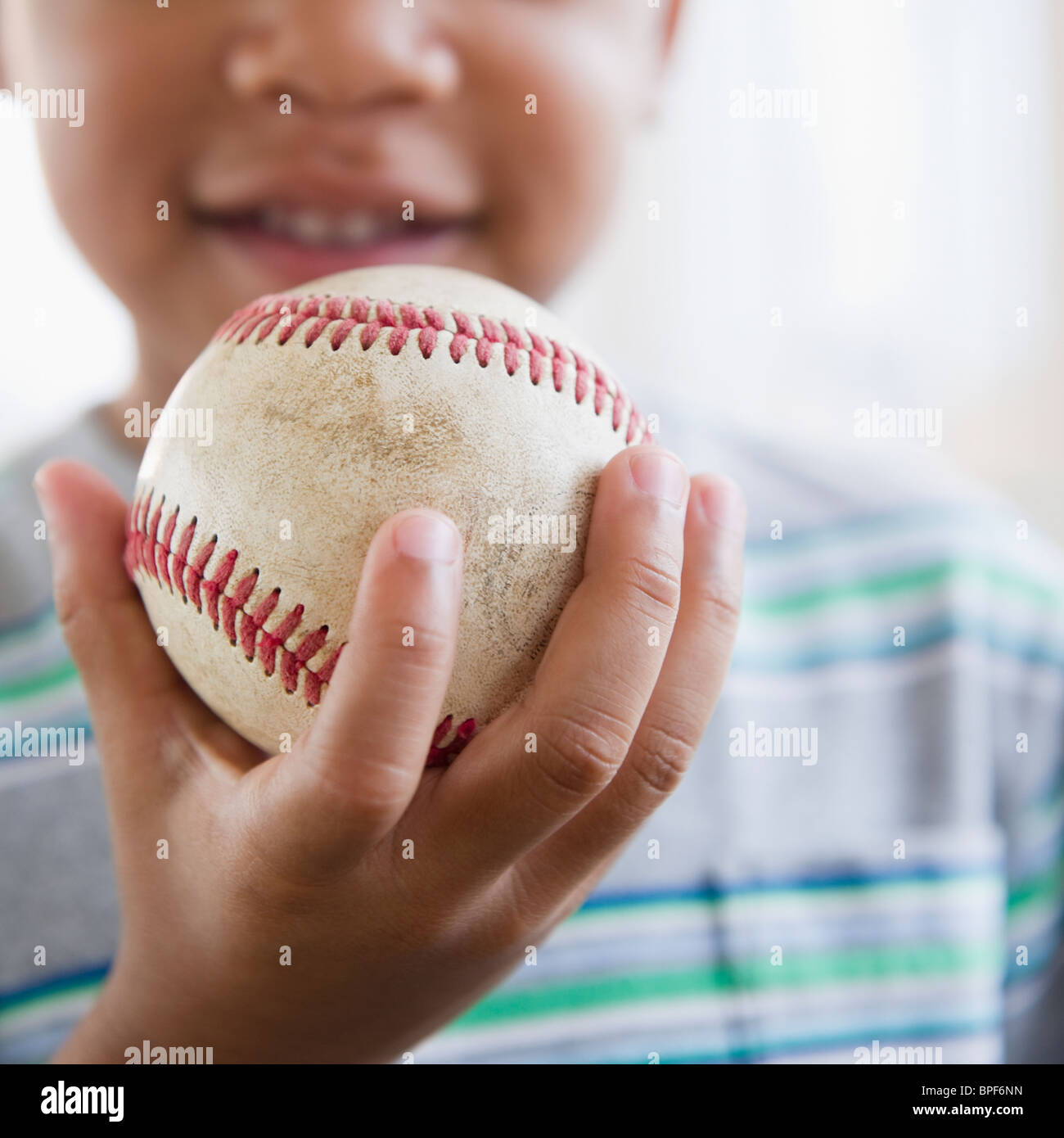 African American Boy Holding baseball Stockfoto