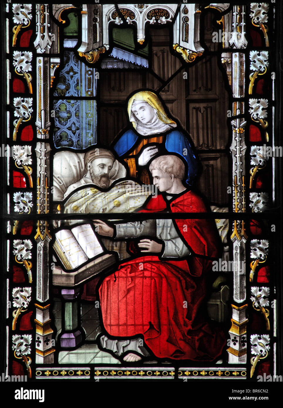 Ein Buntglasfenster von Lavern, Barraud & Westlake, das einen Akt der korporalen Barmherzigkeit darstellt; Besuch der kranken, Marhamchurch Church, Cornwall Stockfoto