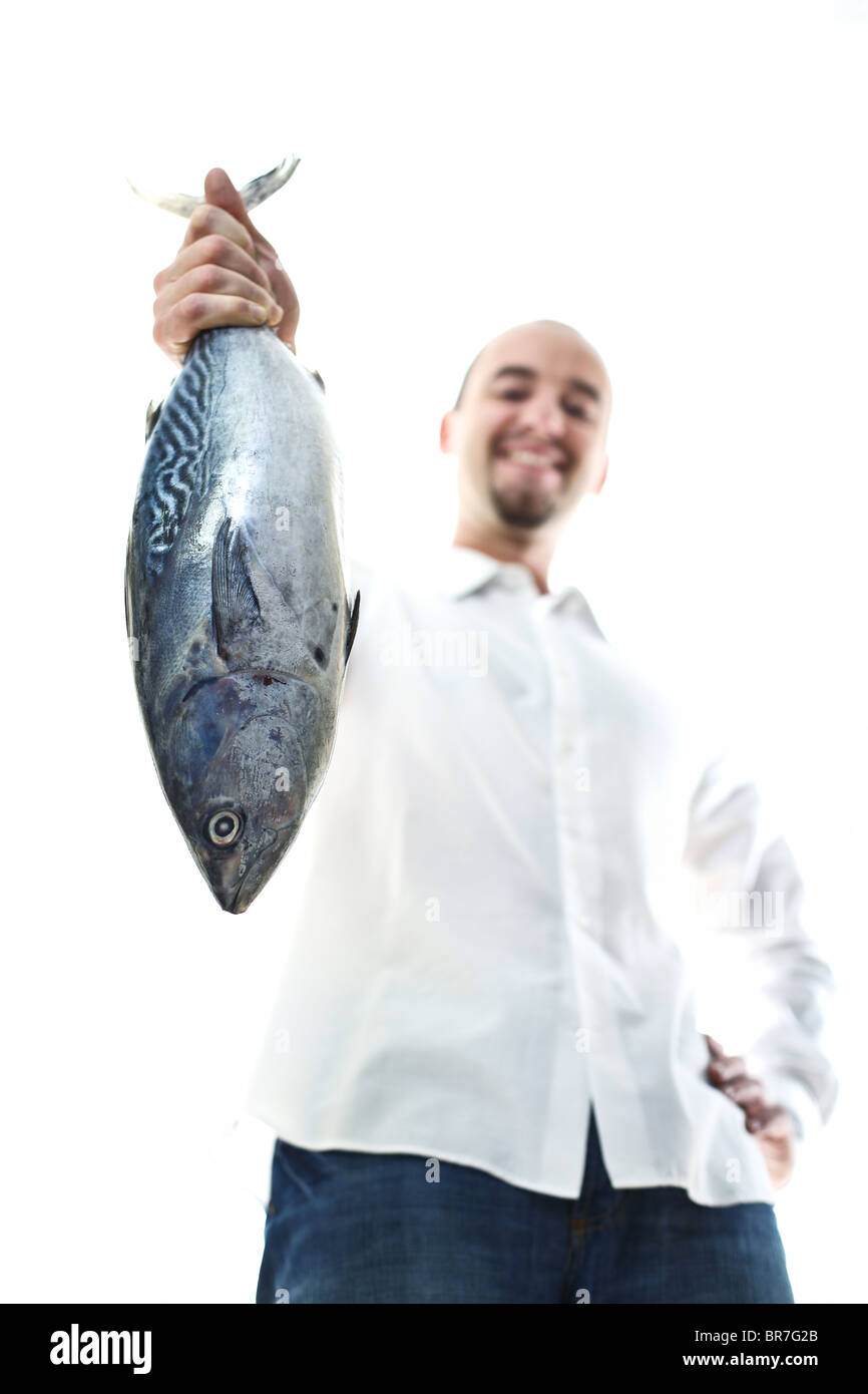 kaukasischen Mann halten große Thunfisch in seiner Hand selektiven Fokus Stockfoto