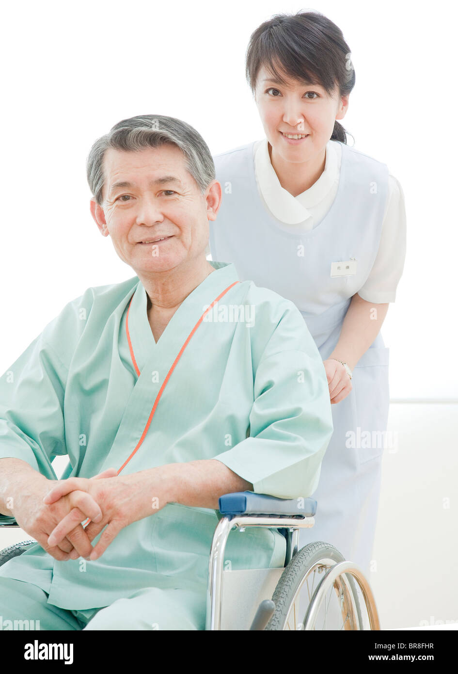 Ältere Menschen Rollstuhl und Care Worker Stockfoto