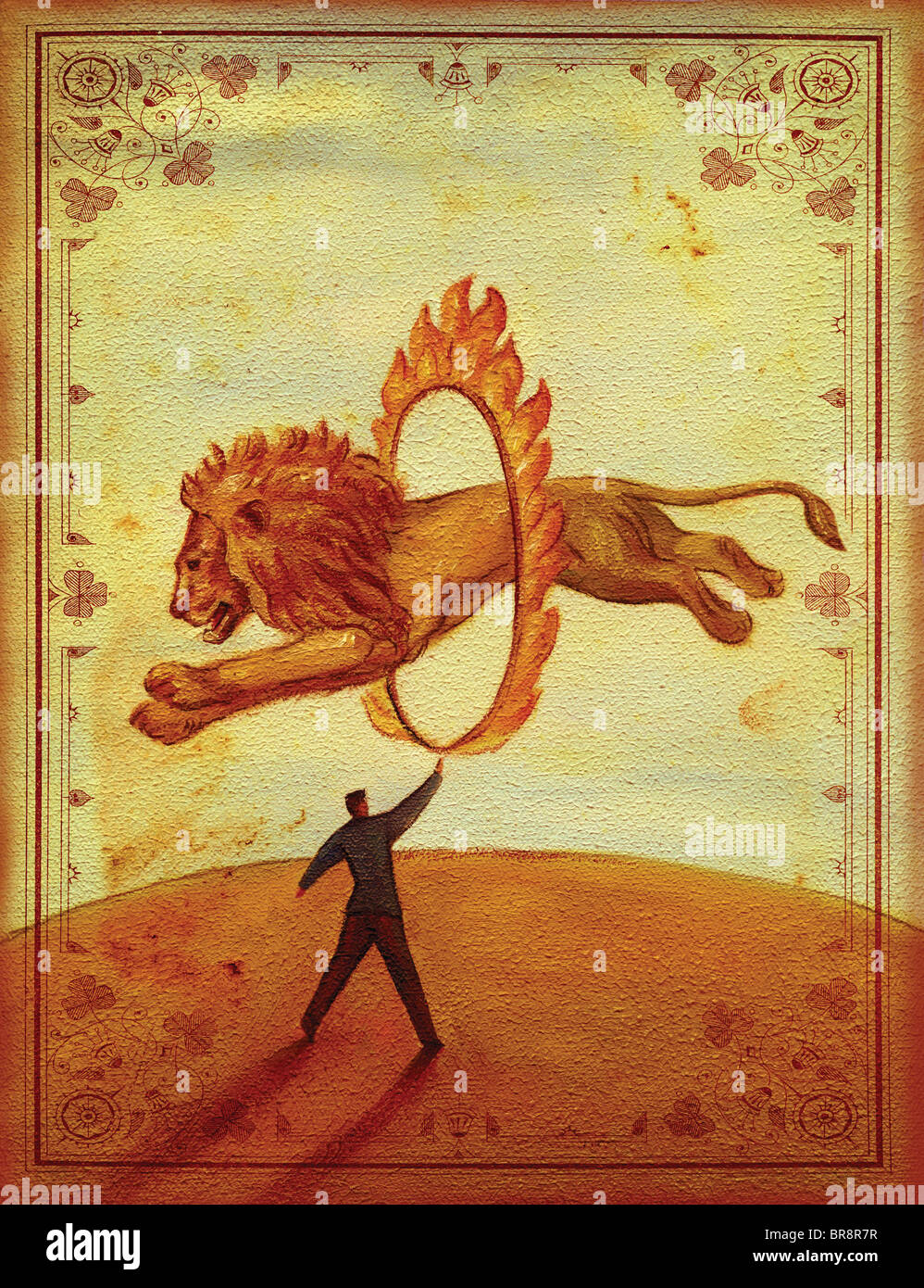 Seitenansicht eines Löwen springen durch einen Ring aus Feuer von einem Mann gehalten Stockfoto